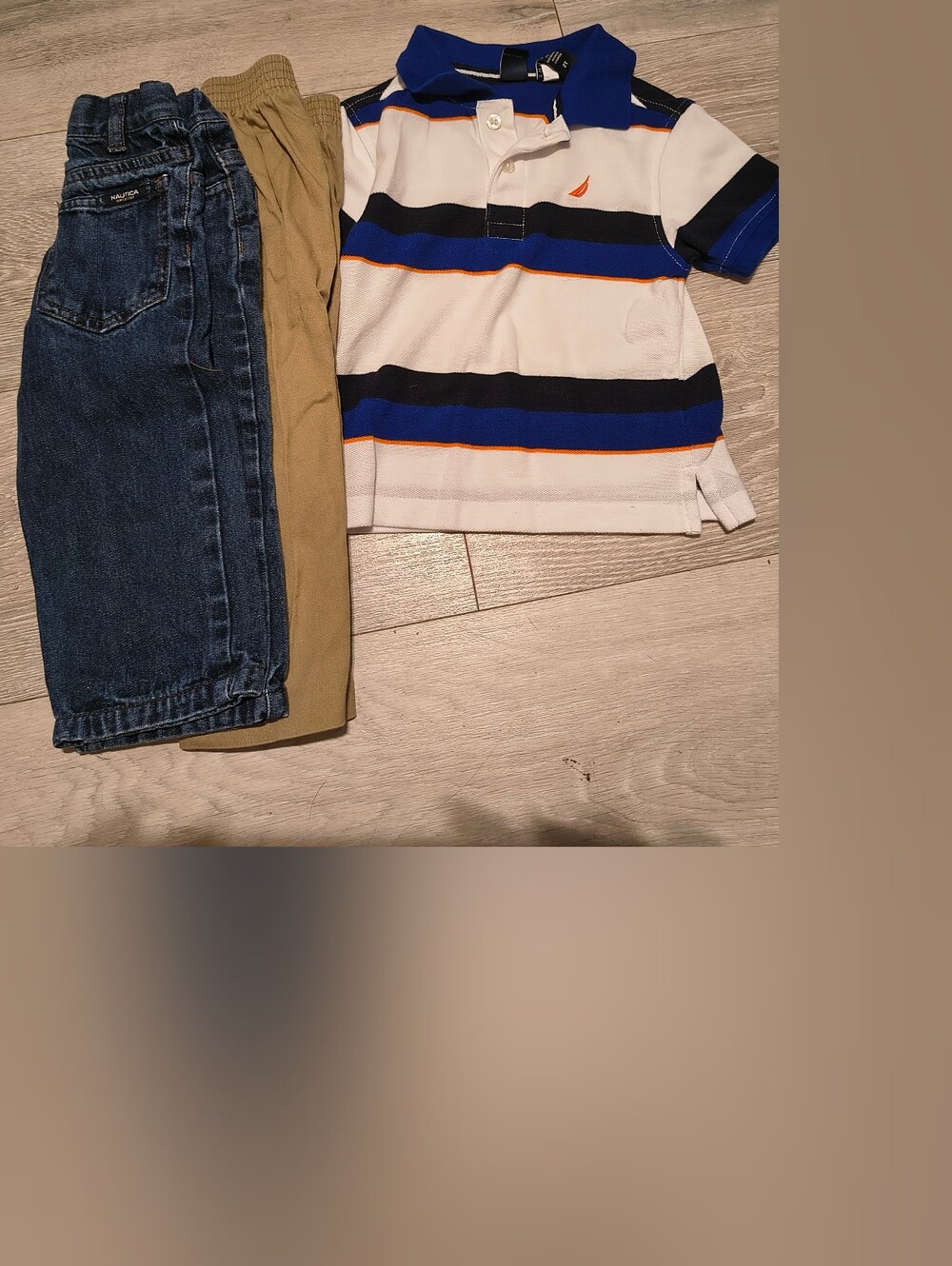 Nautica Blue, White & Navy Striped Polo with Blue Jeans and Tan Pants
